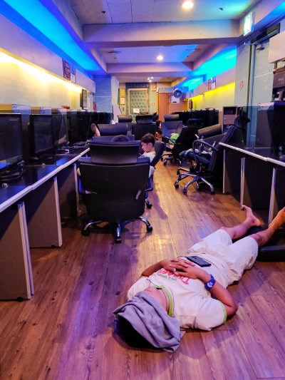 A man sleeping on the floor of a PC room in Dragon Hill Spa, Seoul's most popular jjimjilbang, photo by Ivan Kralj