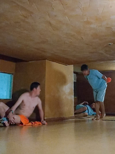 Men cruising in a low-ceiling sleeping area of Hamilton Hotel Sauna, a jjimjilbang popular among gay visitors, photo by Ivan Kralj
