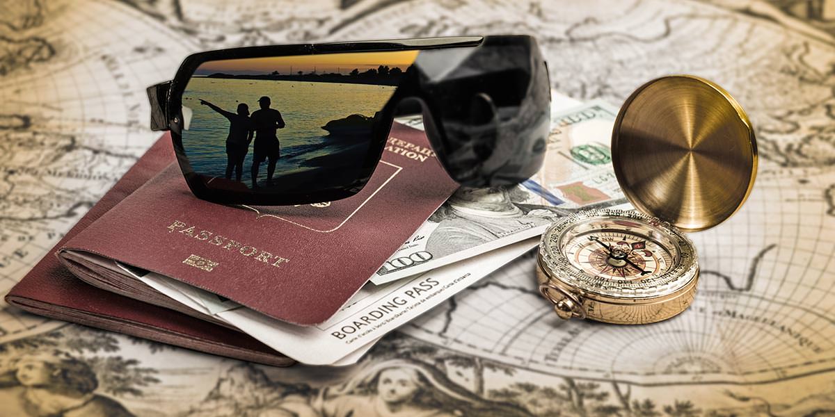 Sunglasses, passport, money, and compass laid on the map, in a travel planning concept, photo by Paulpaladin, Depositphotos.com