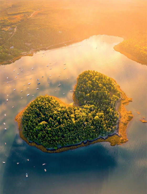Aerial photo of sunrise above Harbor Island in Maine, American heart-shaped island, photo by Jamie Malcolm-Brown