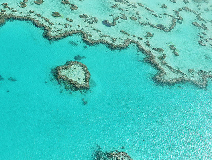 Aerial photo of Heart Reef, Australian coral reef shaped like a heart, photo by Panthermediaseller, Depositphotos