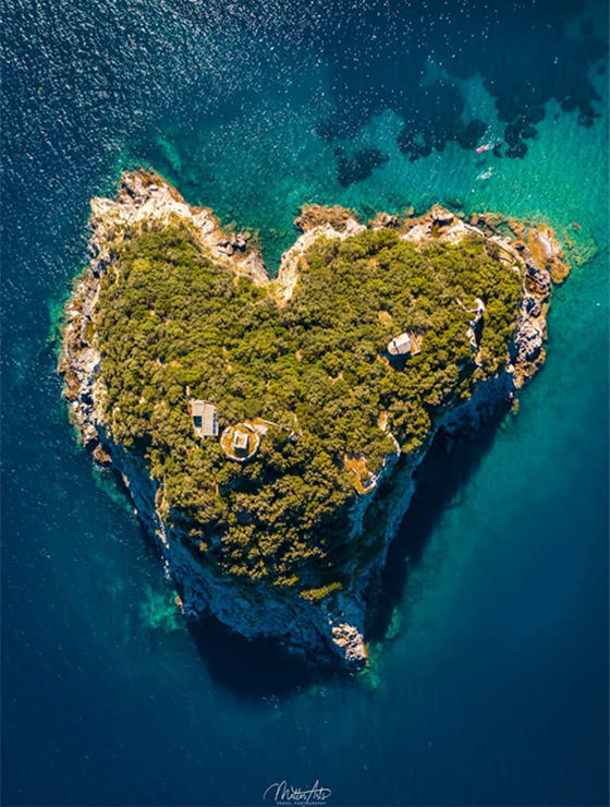 Aerial photo of Isola di Bergeggi, a heart island in Italy, photo by MatterArts