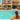 Nude visitors relaxing in and around the swimming pool at Naturist Angel Club Hotel in Rhodes, one of the best clothing-optional resorts in Greece