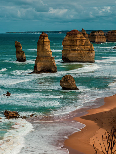 12 Apostles, natural rock pillars in the ocean, one of the stopovers on the Great Ocean Road trip in Australia, photo by Slava Abramovitch, Unsplash
