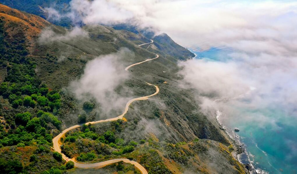 Aerial view of serpentine coastal road in California called Big Sur, one of the best electric car road trips, photo by Venti Views, Unsplash