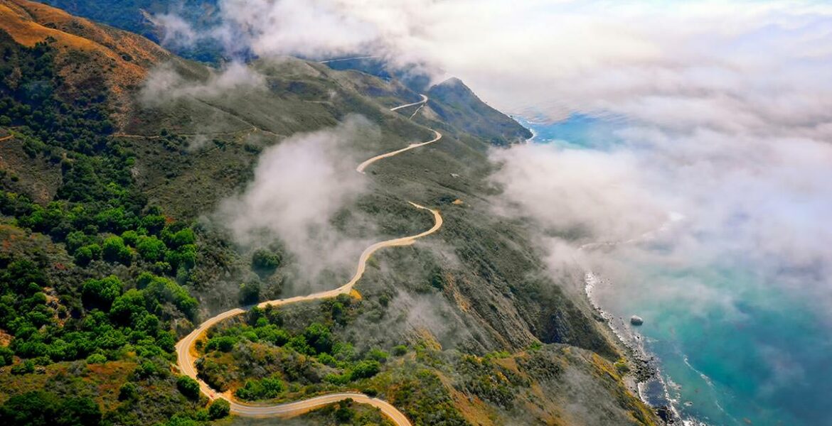 Aerial view of serpentine coastal road in California called Big Sur, one of the best electric car road trips, photo by Venti Views, Unsplash