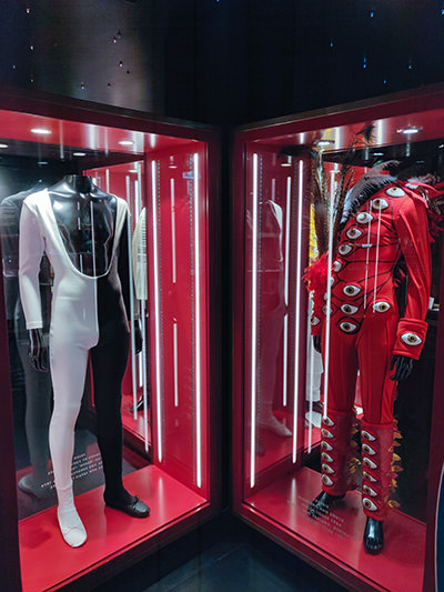 Freddie Mercury costumes displayed in glass boxes at Queen Studio Experience exhibition in Montreux, Switzerland, photo by Ivan Kralj.