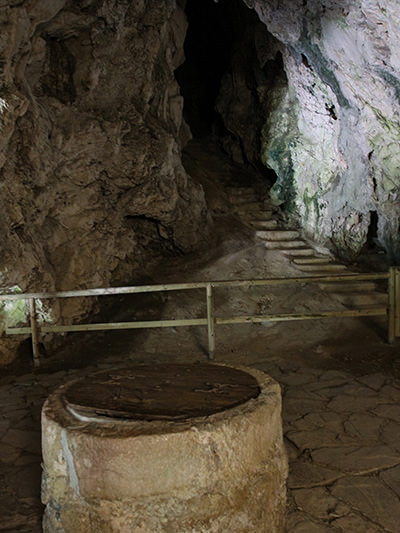 Secret water well and secret staircase in the cave behind Predjama Castle leading to the other side of the mountain; this passageway was used by Erasmus of Lueg to access food during the siege, photo by Ivan Kralj.