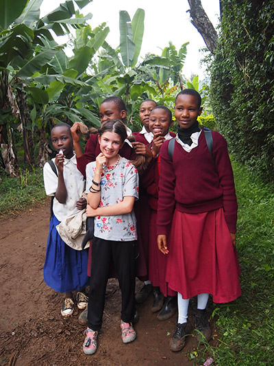 Mia Lemay, a Canadian girl losing eyesight, encircled by African children on her family's trip around the world to fill her visual memory before she goes blind, photo by Edith Lemay