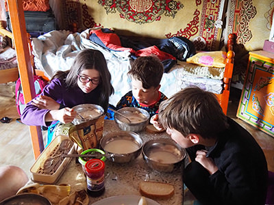 Pelletier-Lemay children having breakfast in a Mongolian tent, during their world trip before three of them lose their eyesight, photo by Edith Lemay