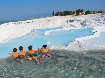 Edith Lemay's children bathing in a hot spring of Pamukkale in Turkey, on their world voyage before they lose eyesight, photo by Edith Lemay