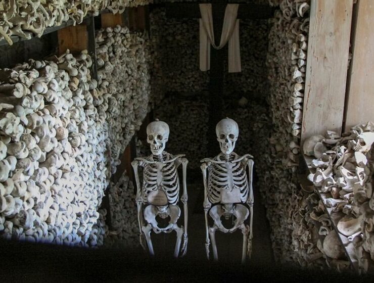 Chamber with skeletons, bones and a cross in Ossuary of Solferino, Lombardy, Italy, photo by Ivan Kralj