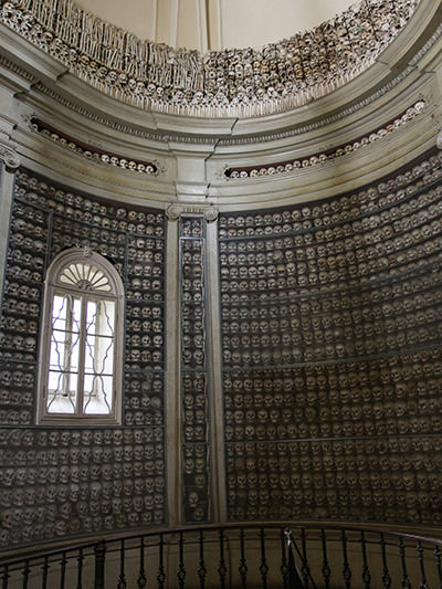 Walls of the apse of the Ossuary of Solferino covered with skulls and bones of soldiers who died in the Battle of Solferino in 1859, Lombardy, Italy, photo by Ivan Kralj.