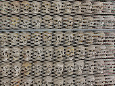 Rows of skulls shelved on the wall of the Ossuary of Solferino, remains of soldiers who fought in the Battle of Solferino 1859, Lombardy, Italy, photo by Ivan Kralj.