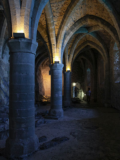 Gothic-style arches in the cellar of Chillon Castle that served as a dungeon/prison, photo by Ivan Kralj.