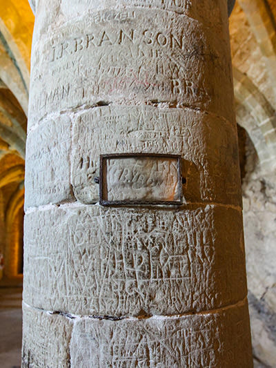 Lord Byron's signature carving on a pillar in Chillon Castle dungeon that inspired him to write a famous poem "The Prisoner of Chillon", photo by Ivan Kralj.