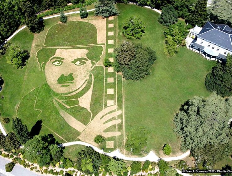 Aerial photograph of Charlie Chaplin's Little Tramp portrait in land art form on a meadow of the silent movie legend's estate in Corsier-sur-Vevey, Switzerland, by artist Franck Bonneau