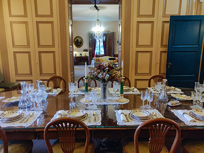 Dining room set for a meal, in Charlie Chaplin's mansion in Corsier-sur-Vevey, Switzerland, photo by Ivan Kralj.