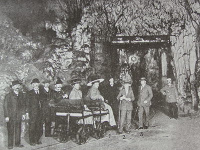 Austrian archduchess Maria Josepha visiting Postojna Cave in 1909, while sitting in the first underground train in the world; carriage was pushed by the cave guide. Copyright Postojna Cave Park Slovenia.