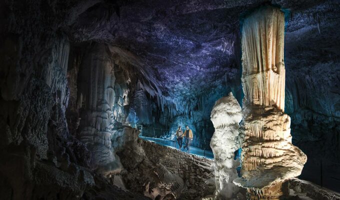 Visitors admiring Brilliant, the symbol stalagmite of Postojna Cave in Slovenia, copyright Postojna Cave Park Slovenia