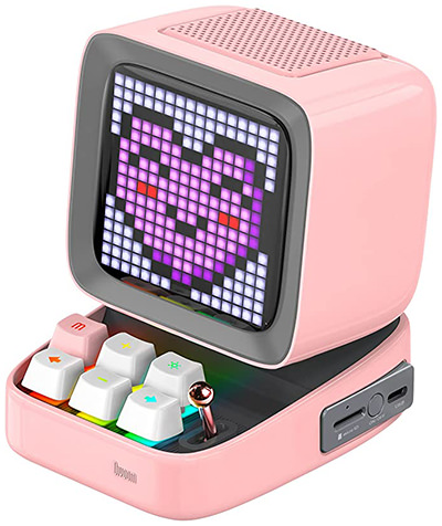 Pixel-art game Bluetooth speaker, resembling a mini vintage computer, with smiling heart on its display, a unique and kawaii gadget to buy as Valentine's Day gift for a girlfriend, by Divoom.