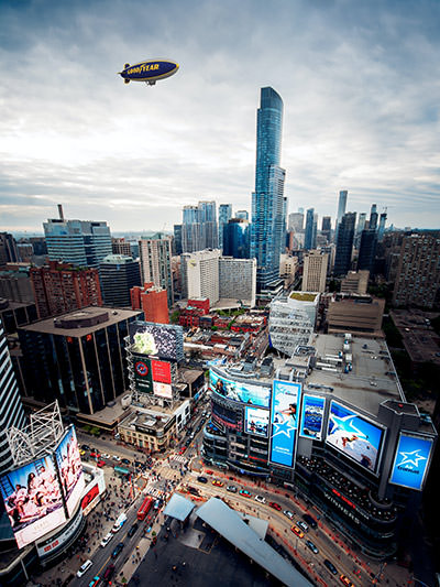 Goodyear Blimp flying over a downtown of Toronto, Canada, photo by Marcin Skalij, Unsplash.