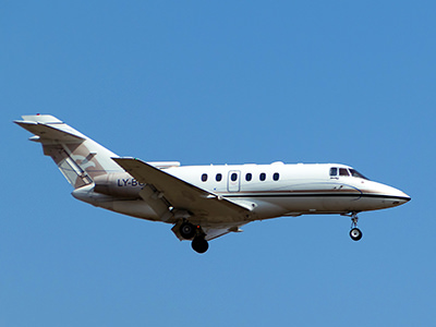 Private jet plane in the air above Zurich, Switzerland, photo by Yoann Donze, Unsplash.