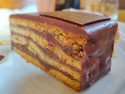 Zserbo szelet or Gerbaud cake, layered cake made of yeast dough, apricot jam, walnuts and chocolate, as served at Cafe Gerbeaud where it was invented in 19th century, photo by Ivan Kralj.