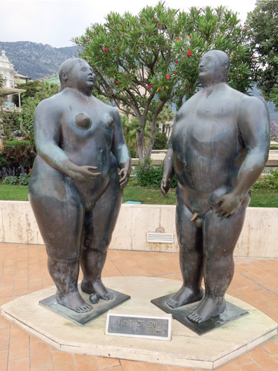 Fernando Botero's statues of Adam and Eve in Monaco, where passersby have discolored Adam's penis by rubbing for good luck; photo by Deltamike.