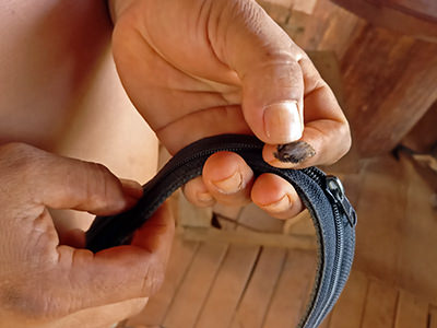 Dried forskin of a black dog, hidden in the secret pocket of a belt of Cambodian man, believing it would protect him from evil spirits; photo by Ivan Kralj.