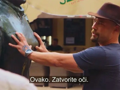 For the purpose of his TV show "Tour guide" ("Turistički vodič"), Croatian travel author Boris Veličan grabbing the breasts of a statue representing the feminist journalist Marija Jurić Zagorka in Zagreb, and explaining to the tourists how to achieve their dreams with the ritual, screenshot HRT.