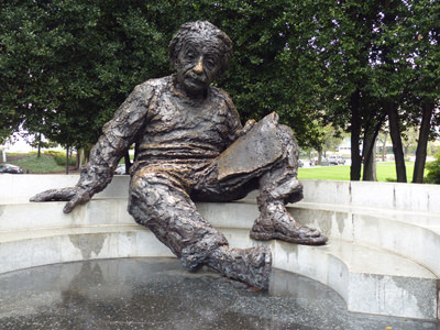 Statue of Albert Einstein at his Memorial in Washington; the bronze statue has a golden hue in the nose area because of the people rubbing it for good luck, photo by mifl68.