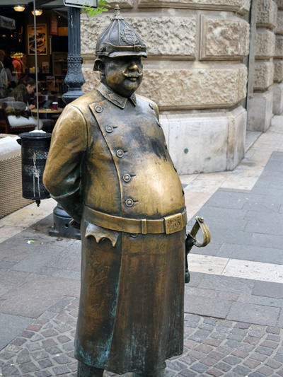 The statue of Fat Policeman in Budapest, Hungary. His rounded belly is often rubbed by the tourists that believe it brings good luck, as well as saves them from gaining weight; photo by Rchappo2002.