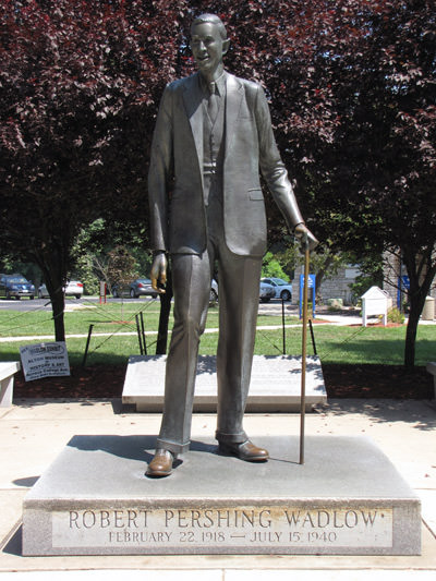 The statue of Robert Pershing Wadlow, the world's tallest man, in Alton, Illinois. His shoes are polished to golden shine by the tourists seeking good luck; photo by Anthonylibrarian.