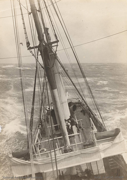 Ship navigating rough seas of Antarctica, shot during the British Antarctic Expedition 1907-1909.