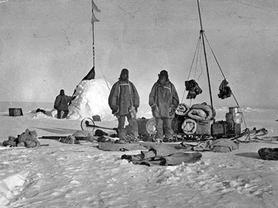 Southern party Antarctic explorers posing with equipment at Depot A during the British Antarctic Expedition 1907-1909, copyright National Archives of Australia.