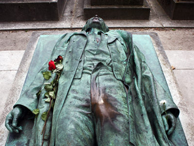 The statue on Victor Noir's grave in Paris. The green patina has been rubbed off of the statue by visitors believing that touching the journalist's private parts can secure them fertility and great sex life; photo by Istolethetv.