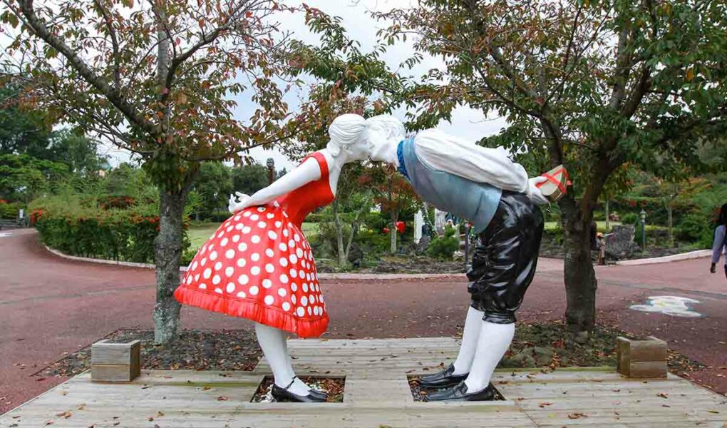 Sculpture of two lovers kissing while standing at distance, an exhibit at Jeju Loveland erotic theme park in Jeju Island, South Korea, photo by Ivan Kralj.