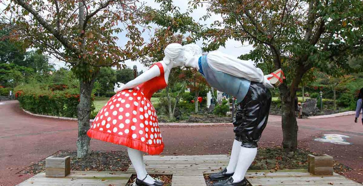 Sculpture of two lovers kissing while standing at distance, an exhibit at Jeju Loveland erotic theme park in Jeju Island, South Korea, photo by Ivan Kralj.