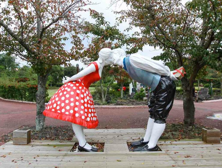 Sculpture of two lovers kissing while standing at distance, an exhibit at Jeju Loveland erotic theme park in Jeju Island, South Korea, photo by Ivan Kralj.