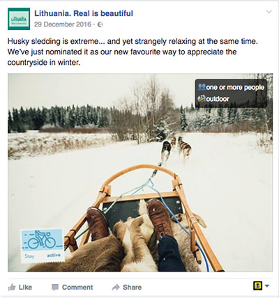 Screenshot from "Lithuania. Real is beautiful" Facebook page, the tourism marketing campaign promoting husky sledding, with a photograph shot in Finland.