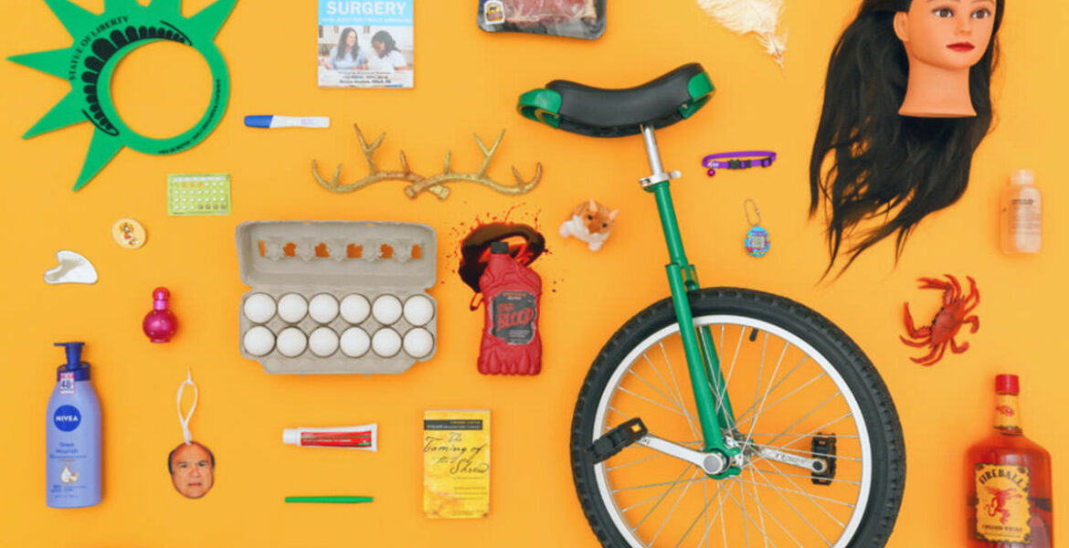Display of a variety of items in Uber Lost and Found Index for 2023, from eggs and fake blood to unicycle and doll head.