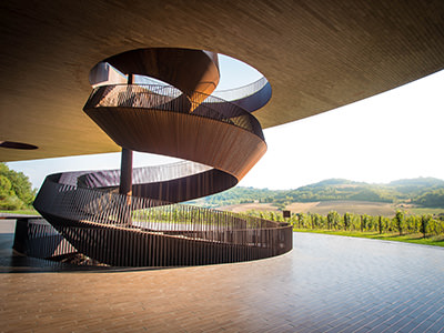 Spiral staircase of the innovative architecture by Marco Casamonti at Antinori nel Chianti Classico winery, one of the top Italian wineries; photo by Ivan Franco Bottoni, Unsplash.