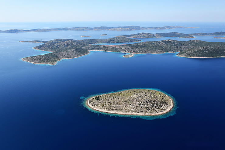 Aerial view of Bavljenac, Croatian island that looks like a fingerprint, due to a network of dry stone walls covering the island like papillary lines; photo by Boris Kačan.