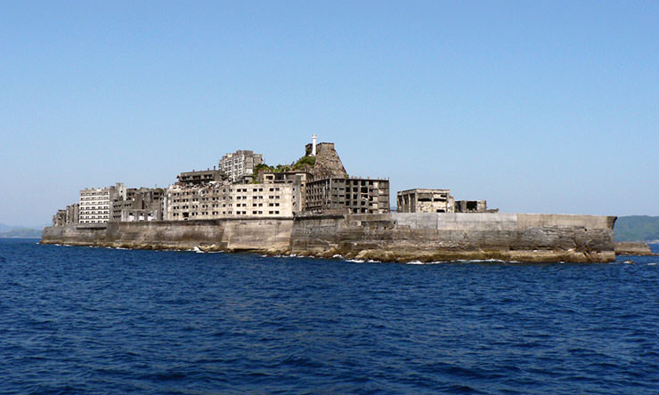 Hashima island off the coast of Nagasaki, also known asa Gunkanjima or Battleship Island, due to its resemblance with a warship; photo by Hisagi.