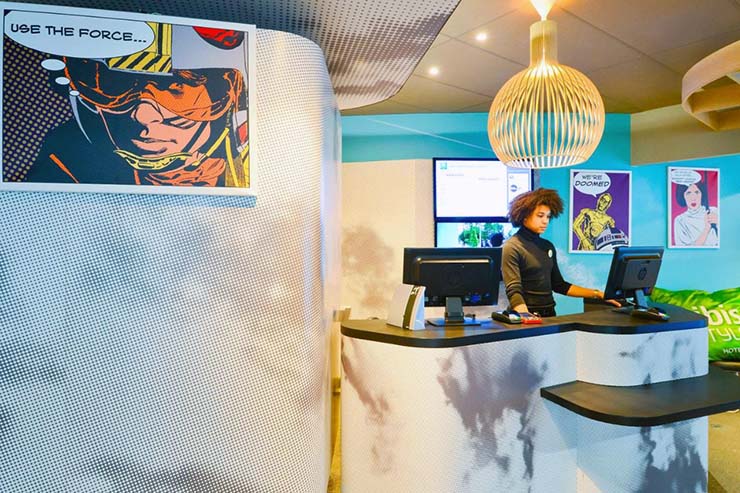 Reception of Ibis Styles hotel in Paris, decorated with comic-style artwork from the Star Wars.
