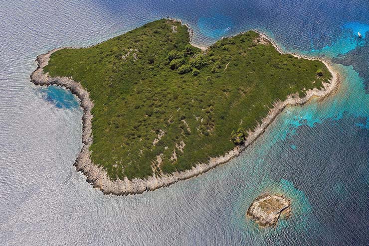 Aerial view of Majsan, Croatian island whose contours resemble the Tongue and Lips, famous logo of The Rolling Stones; photo by Boris Kačan.