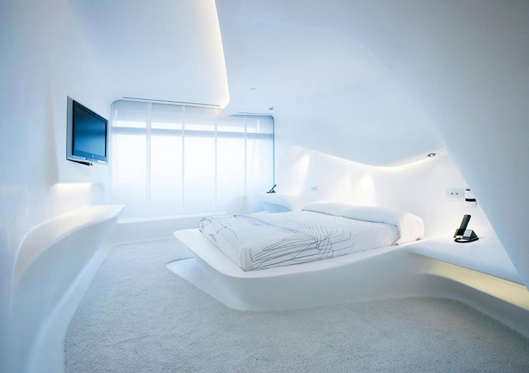 Futuristic white Space Club room with curved lines designed by Zaha Hadid, at Puerta America Hotel in Madrid, Spain.
