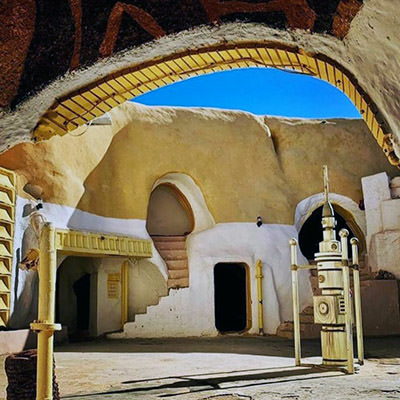 Sidi Idriss Hotel courtyard in Tunisia, one of the filming locations for Star Wars trilogy, with "moisture vaporator" still in the center; photo by Booking.com.