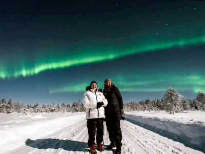 TikTok Traveling Grannies in a snowy landscape in Finland, Lapland, with Northern Lights in the sky.
